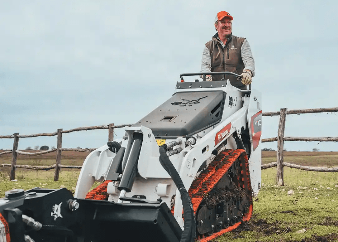 Chip Gaines standing on Bobcat MT100 with NonMarking Tracks